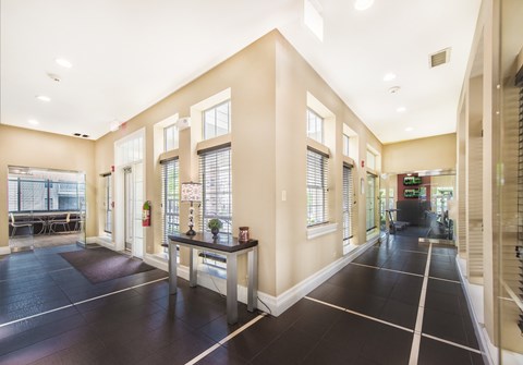 A spacious room with black flooring and white trim.