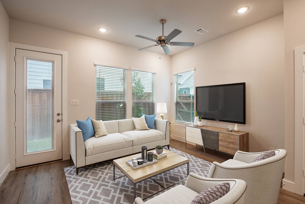 a living room with a couch and a tv
