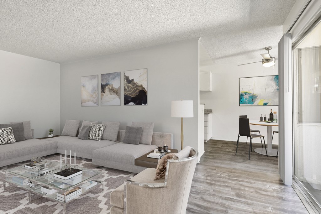 a living room with a couch and chairs and a table at Pacific Rose, 90034