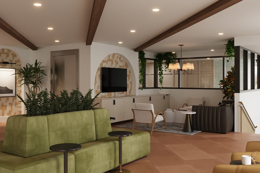 a living room with a couch and chairs and a television