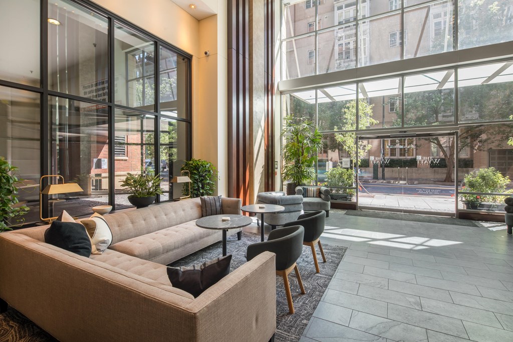 a living room filled with furniture and a large window