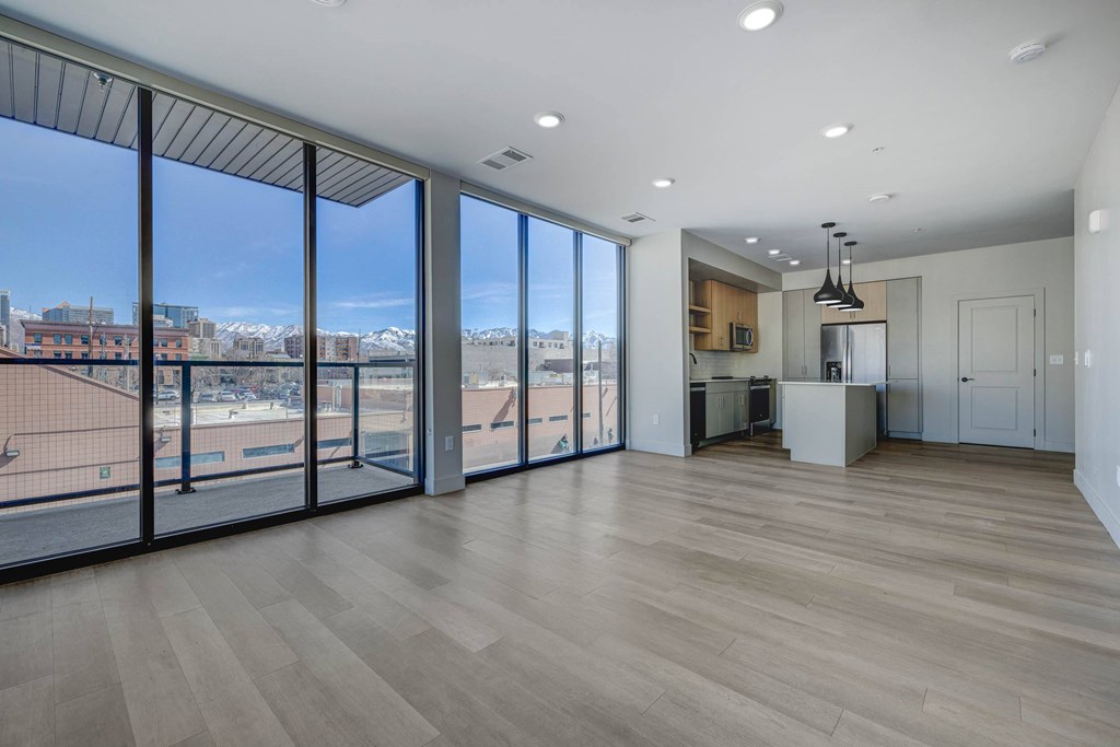 Large room with large windows and city views at Luma new Salt Lake City apartments.