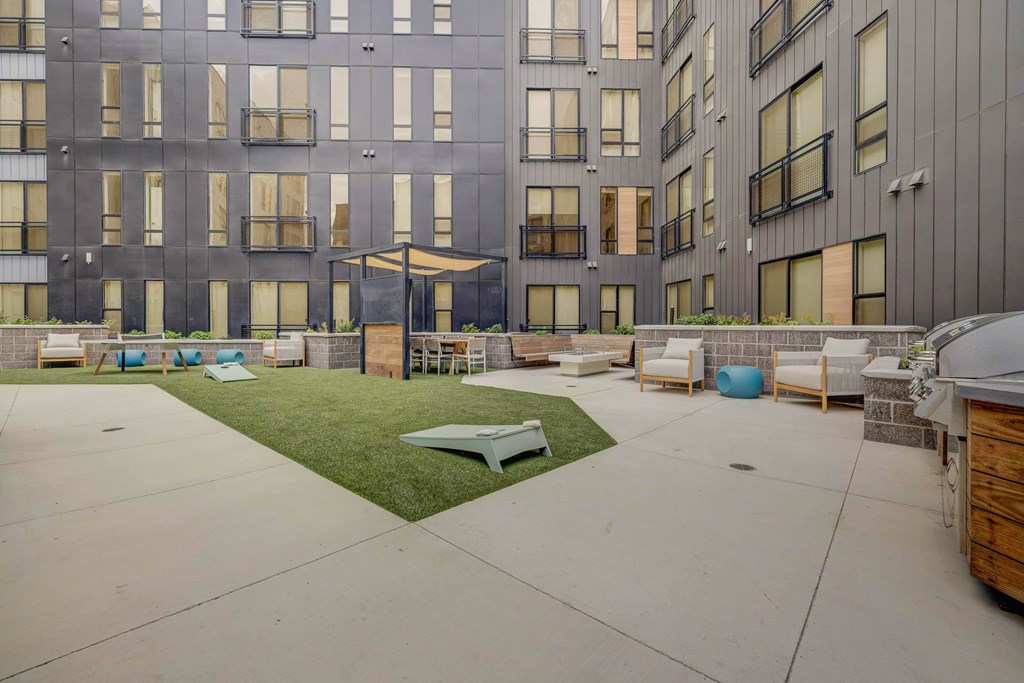 A modern building with a courtyard and a bicycle.