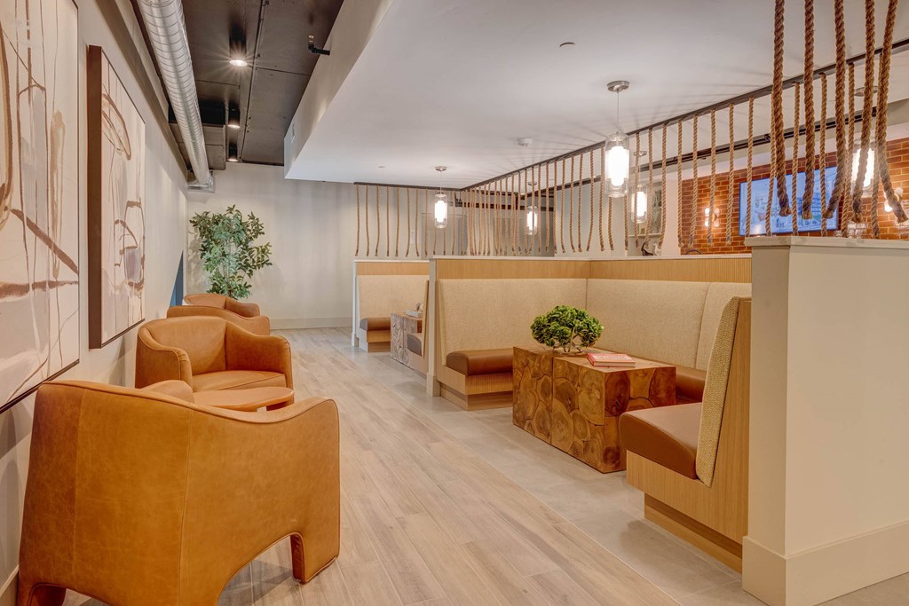 A room with wooden chairs and tables.