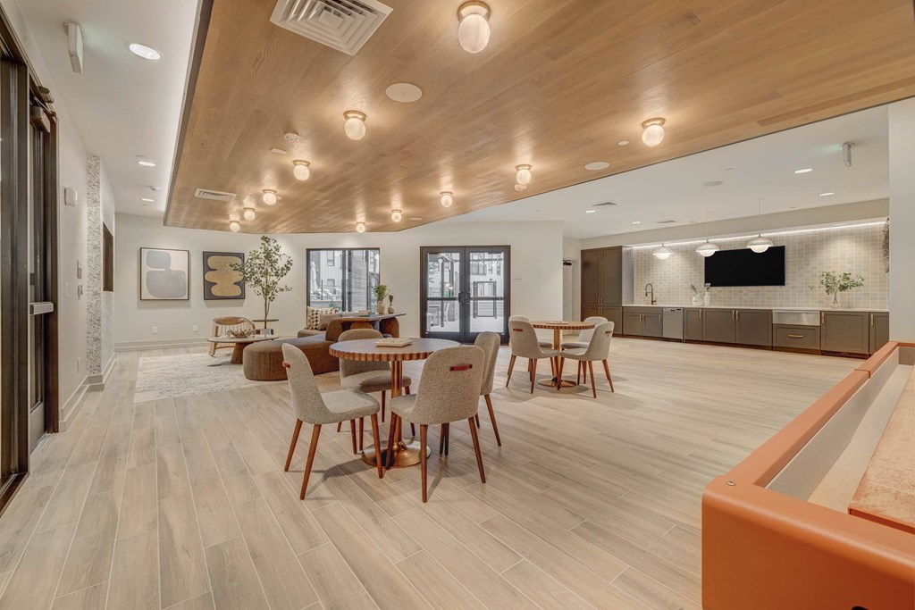 A modern dining room with a pool table.