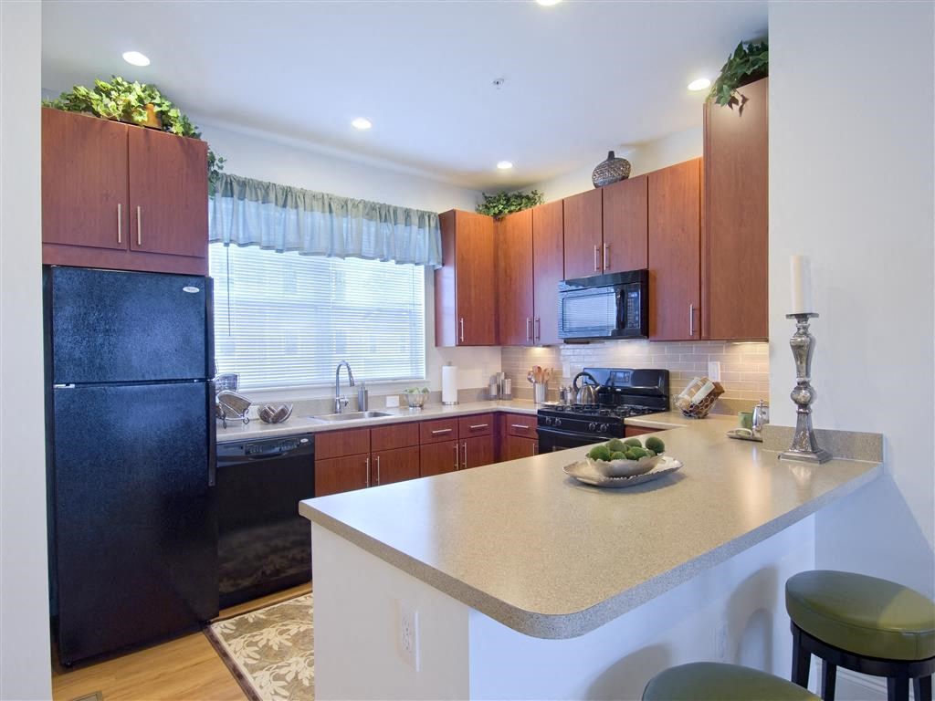 Fitted Kitchen With Island Dining at The Preserve at Cohasset, Massachusetts