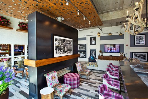 A living room with a black and white photo on the wall.