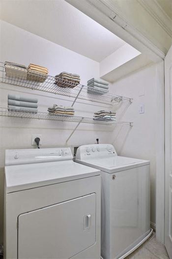 a white washer and dryer in a room