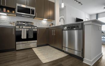 Gas Ranges in a kitchen with stainless steel appliances at Metro Mission Valley, San Diego, 92108