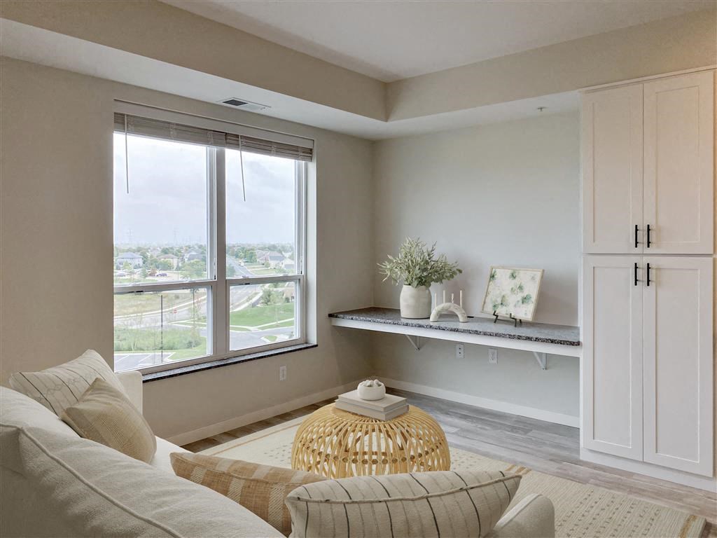 a living room with a couch and a window