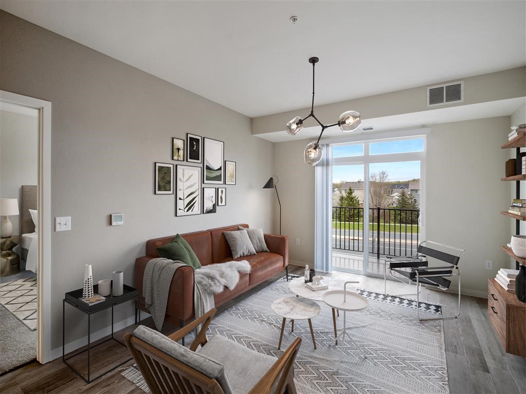 a living room with a couch and a large window