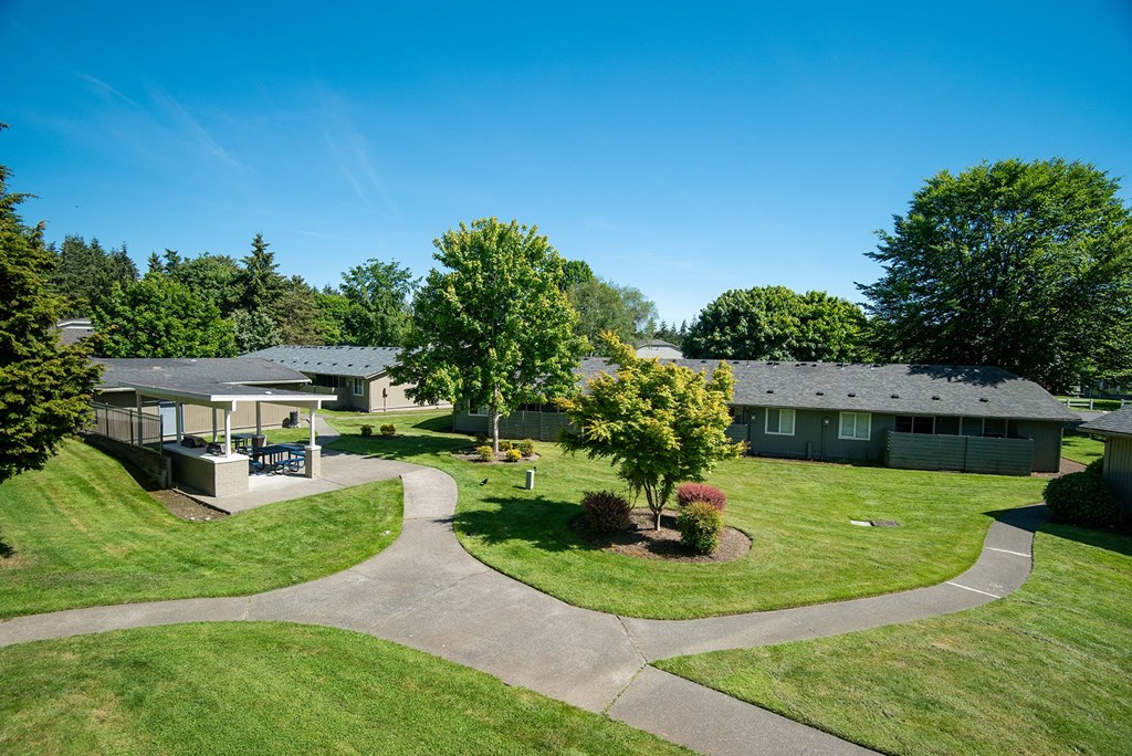 an aerial view of a neighborhood with houses and trees