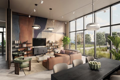 A modern living room with a large television and comfortable seating.