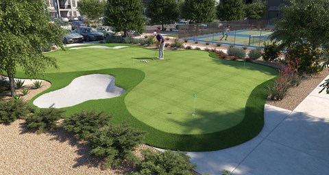 A man is playing golf on a green course.