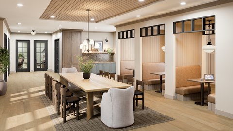 A modern dining room with a long table and chairs.