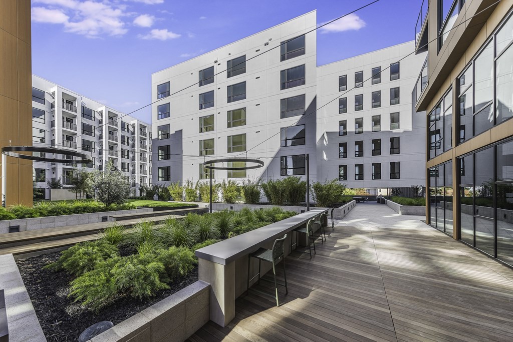 A modern building with a wooden walkway in front.