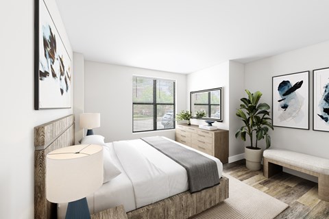 a bedroom with a bed and a dresser in a 555 waverly unit