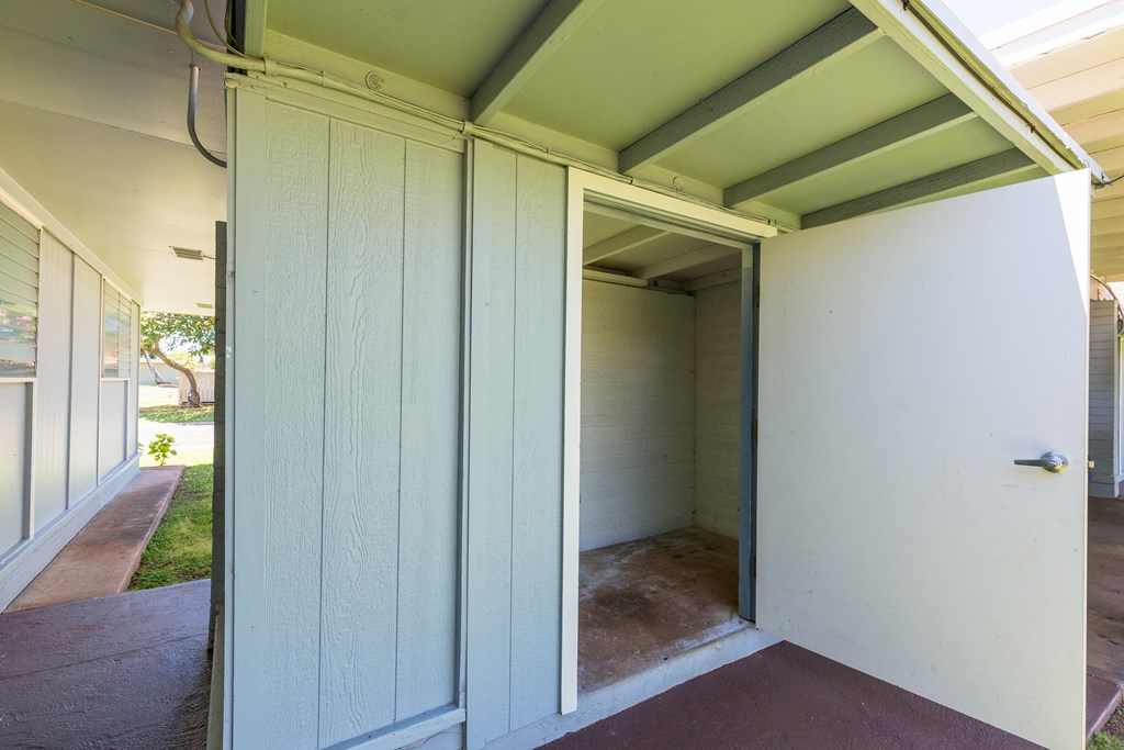 an open closet door on the outside of a house
