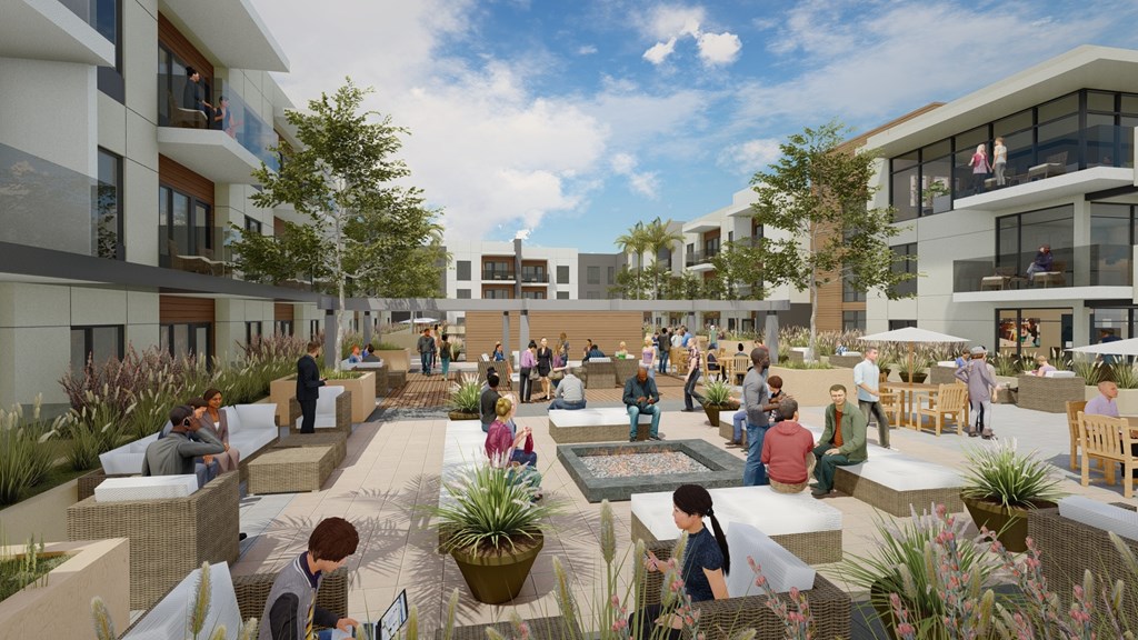 A group of people are sitting and standing on a patio.