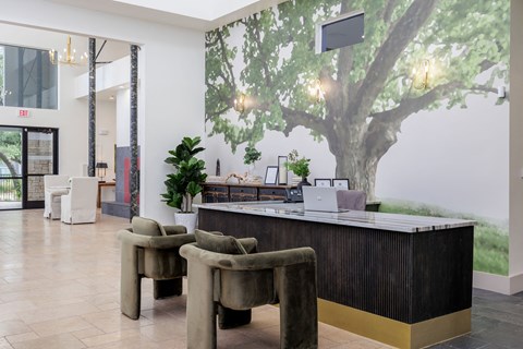 Tree mural on the wall behind the check in