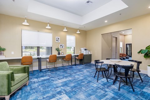 Co-working lounge with tables and chairs