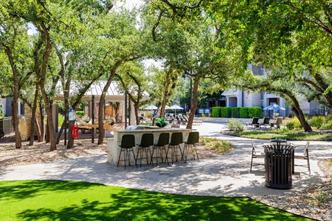 Green landscaping around the resident pool