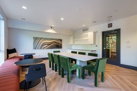 a dining room with a table and chairs and a couch