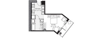 A floor plan of a studio apartment with a kitchen and a studio space.