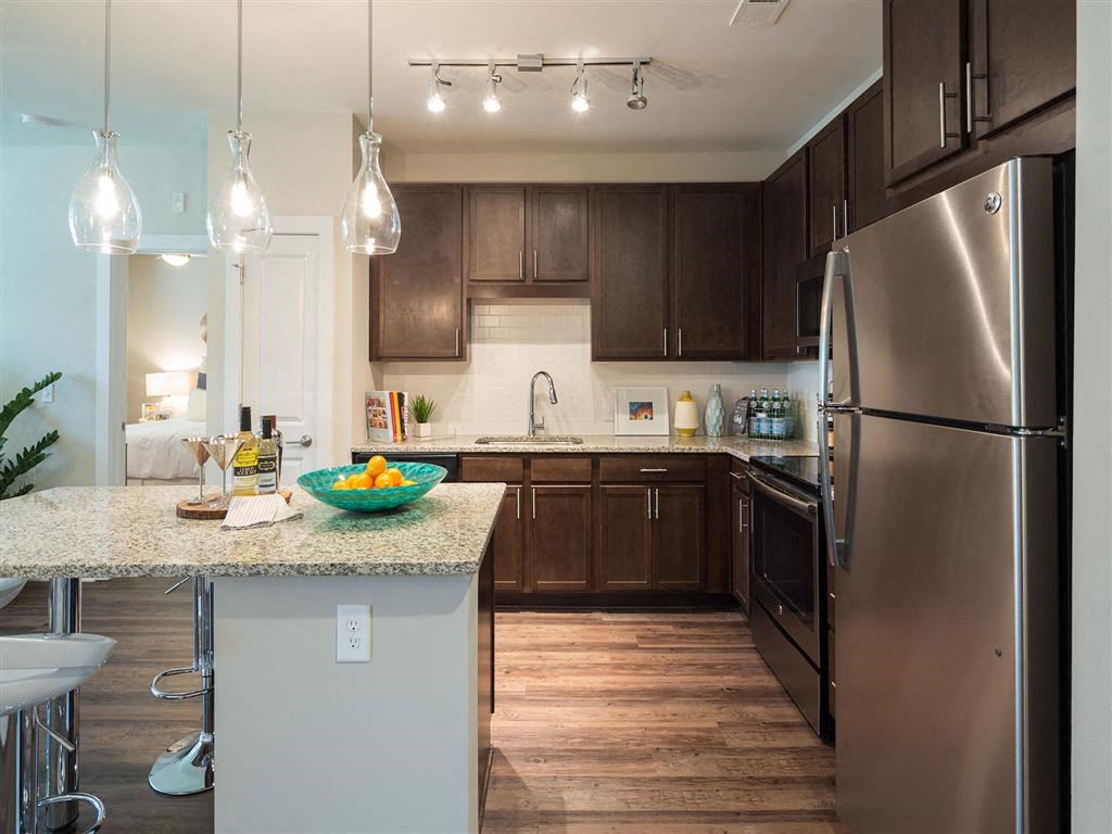 a kitchen with stainless steel appliances and a counter top