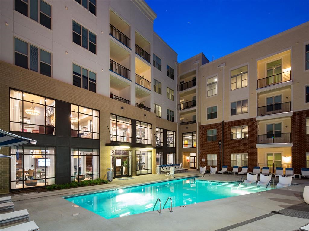 a swimming pool in the middle of an apartment building