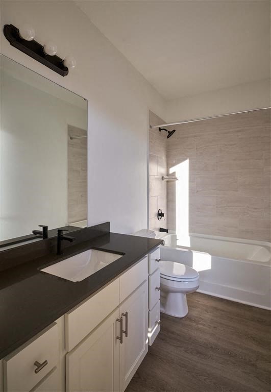 a bathroom with a toilet sink and bathtub