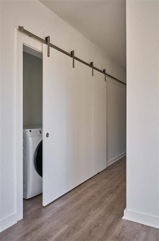 a washer and dryer in a room with a sliding door