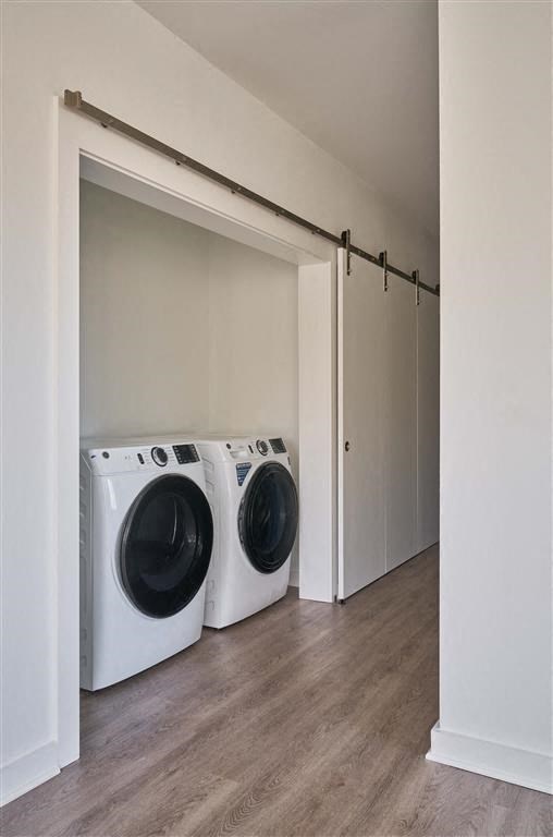 a washer and dryer in a room with a sliding door