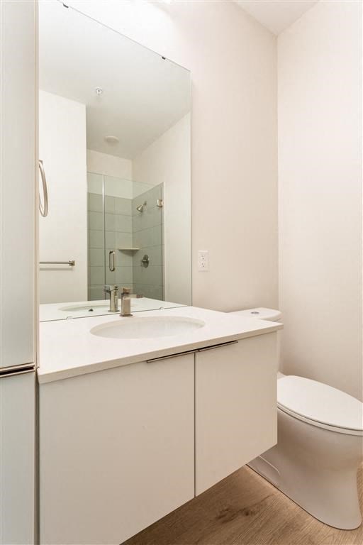 a bathroom with a sink toilet and a mirror