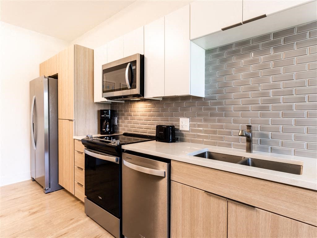 a kitchen with stainless steel appliances and a sink