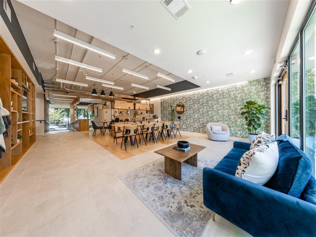 the living room is open to the dining room and kitchen