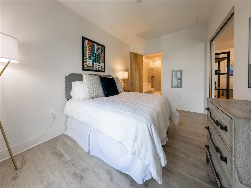 a bedroom with a bed and a closet