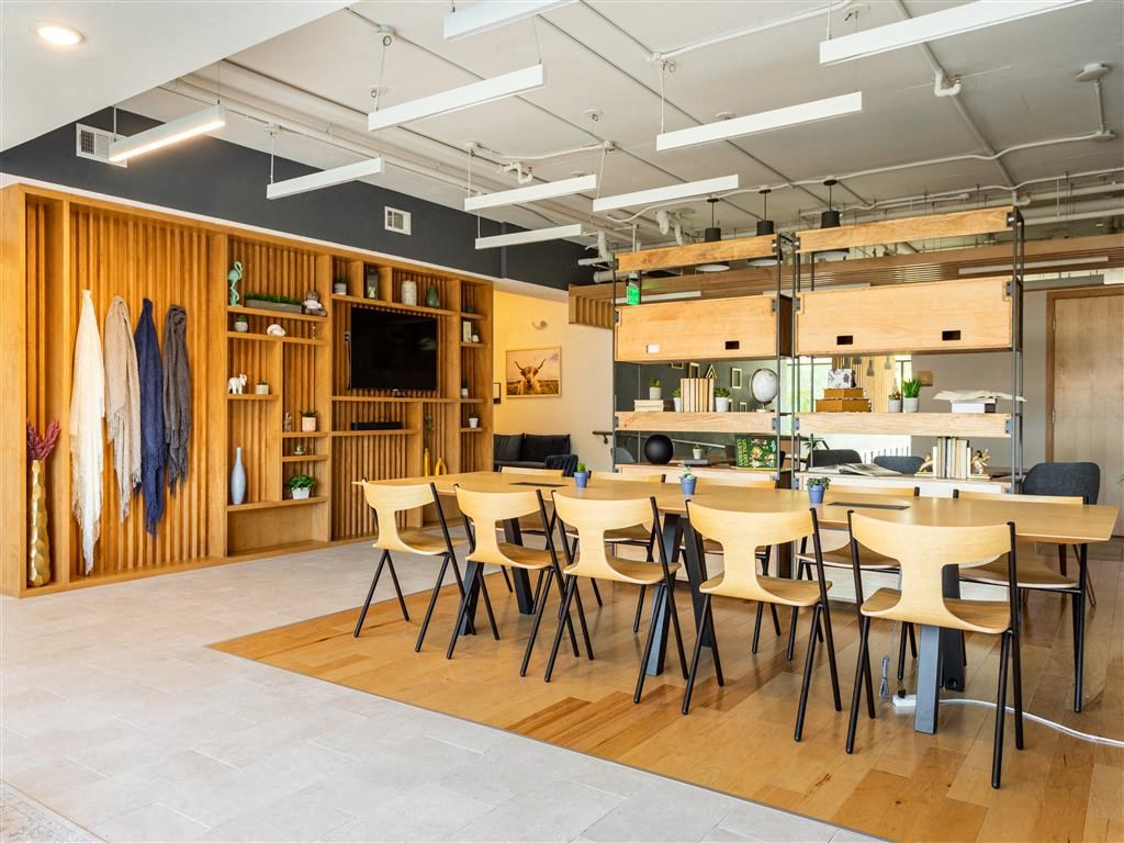 a dining room with tables and chairs in a room