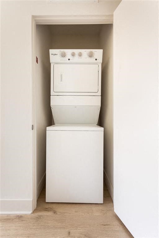 a white washer and dryer in a closet
