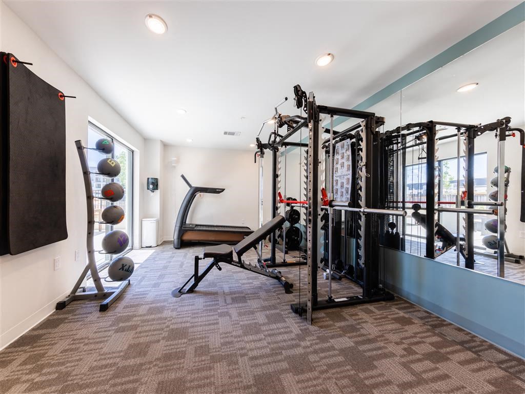 a gym with weights and other equipment in a home