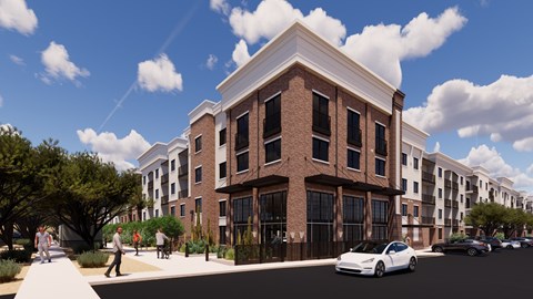 A white car is parked on the street in front of a building.