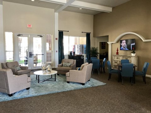 a living room with couches chairs and a table