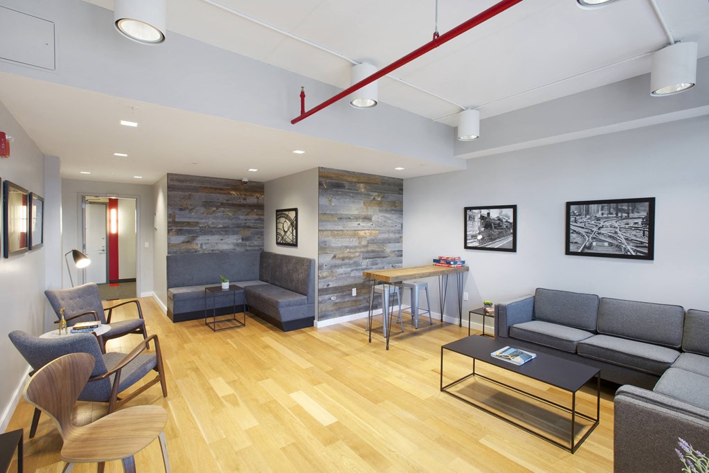 a living room with couches and chairs and a table