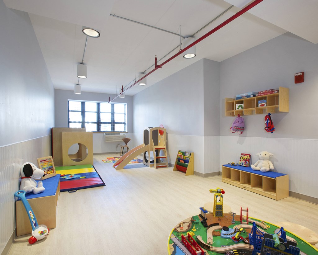 a childs play room with toys and toys on the floor
