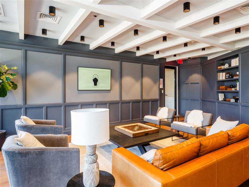 a living room with couches and chairs and a table