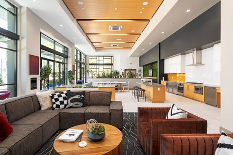 A modern living room with a brown sofa and a wooden coffee table.