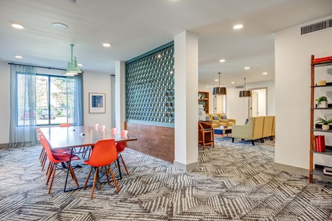 a dining room with a table and chairs and a living room