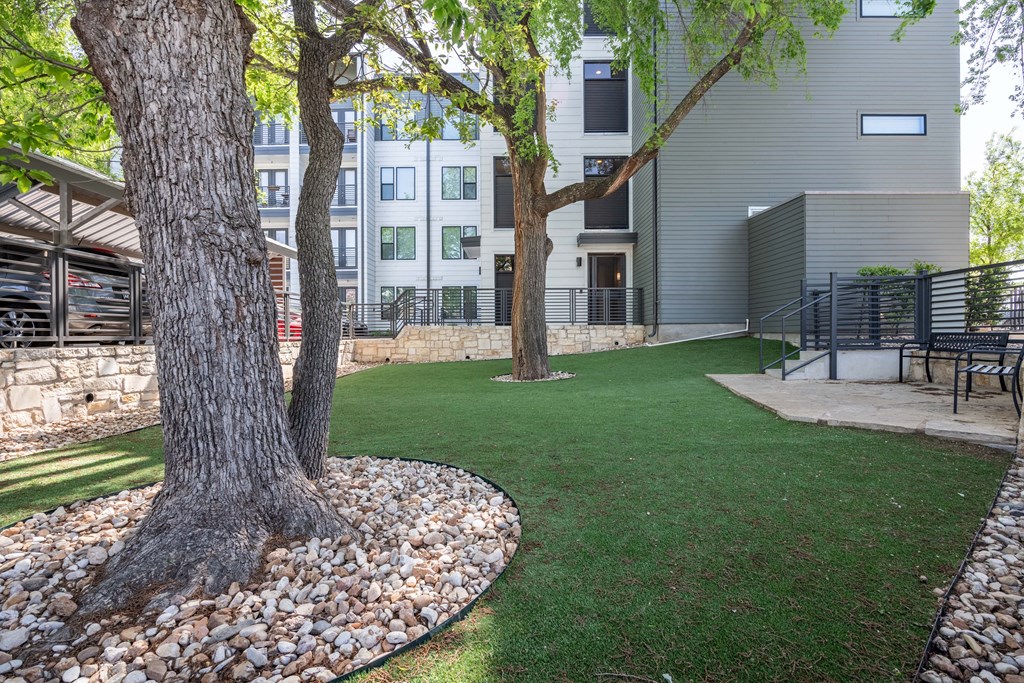 our apartments have a spacious courtyard with trees and grass