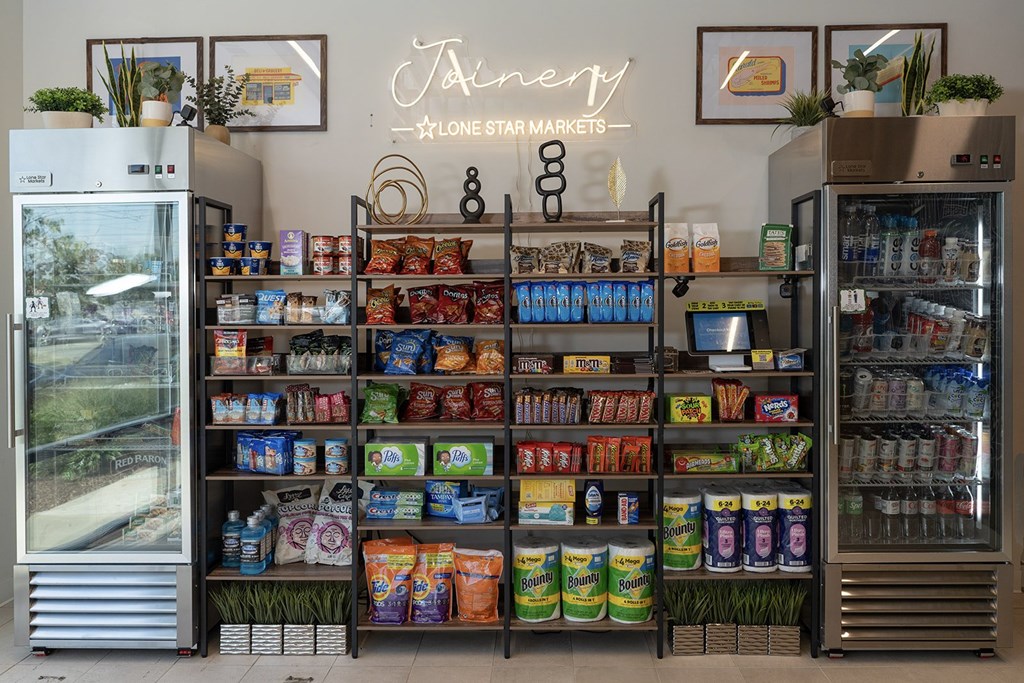 A display of various packaged foods and drinks in a store.