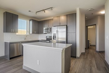 Kitchen view with window above sink and stainless steel appliances - Photo Gallery 2